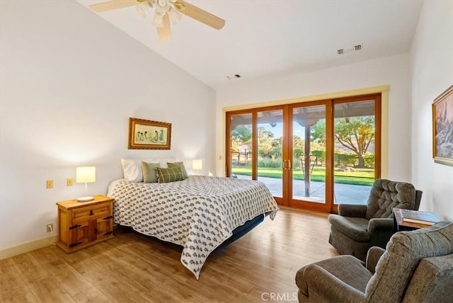 bedroom featuring access to exterior, ceiling fan, french doors, light hardwood / wood-style flooring, and lofted ceiling