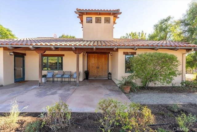 back of property featuring a patio area