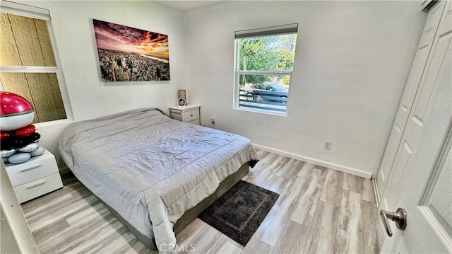 bedroom with light hardwood / wood-style flooring