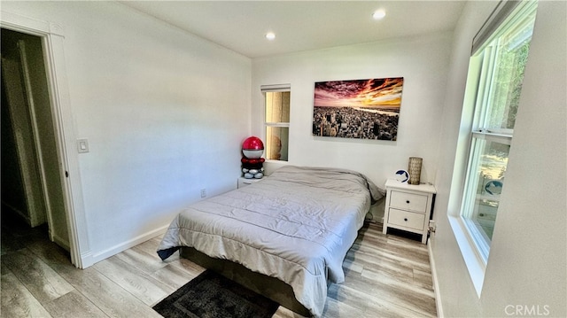 bedroom featuring light wood-type flooring