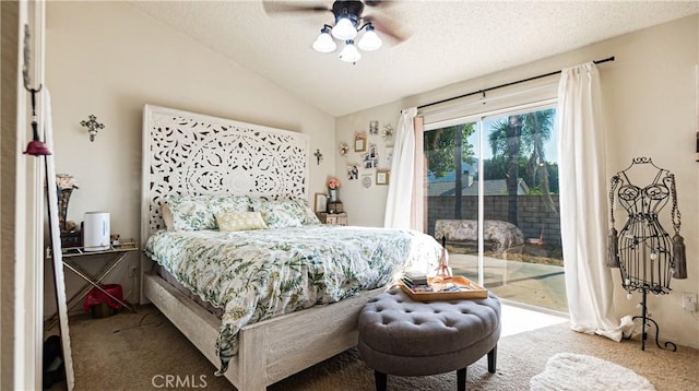 carpeted bedroom with vaulted ceiling, a textured ceiling, a ceiling fan, and access to exterior