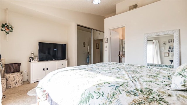 bedroom with light carpet, visible vents, and vaulted ceiling