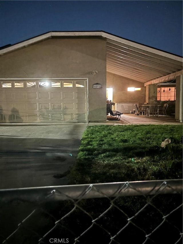 exterior space with a patio and a garage