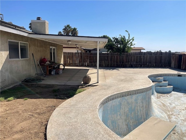 view of patio / terrace featuring an empty pool