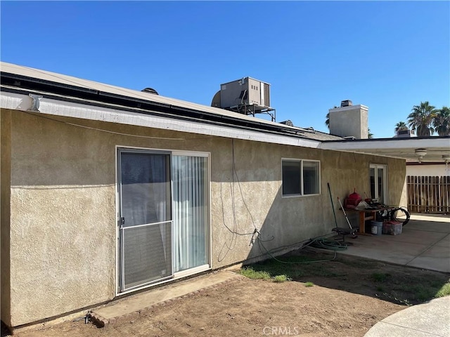 view of home's exterior with a patio area and central air condition unit