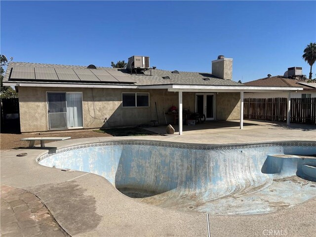 view of pool featuring a patio area and central AC