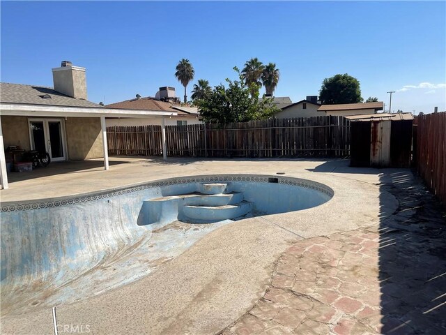 view of swimming pool with a patio