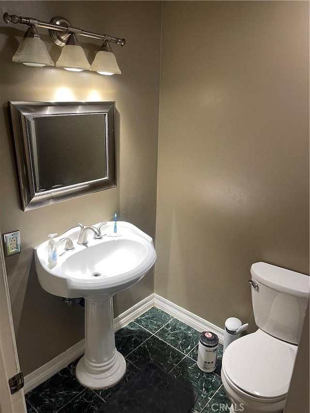 bathroom featuring toilet