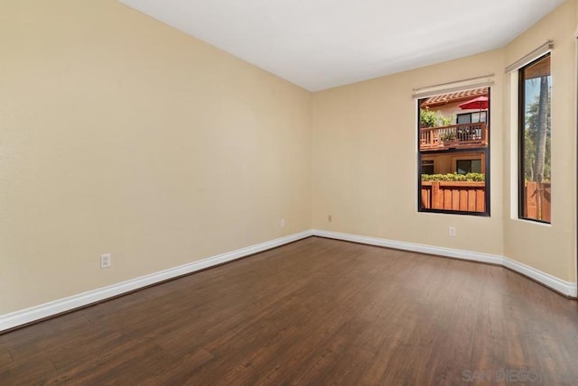 spare room with wood-type flooring