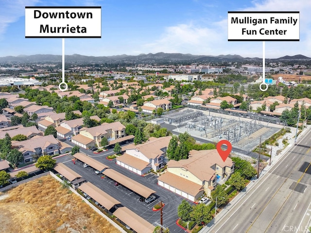 birds eye view of property with a mountain view