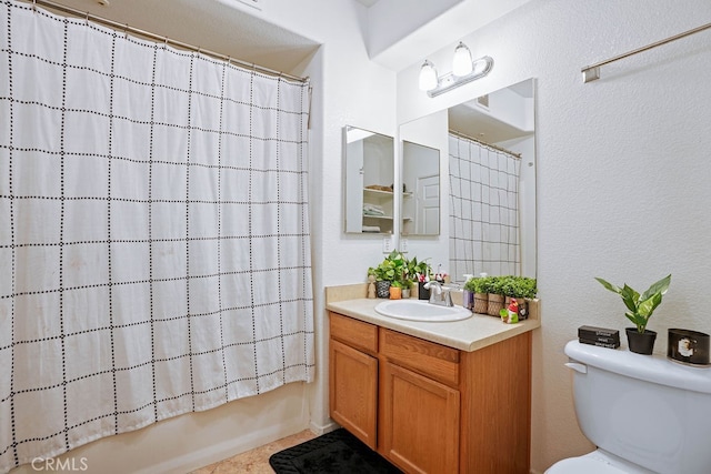 full bathroom featuring vanity, shower / tub combo, and toilet