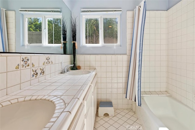 bathroom featuring tile walls, vanity, and tile patterned floors