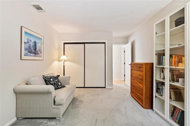 sitting room with light colored carpet