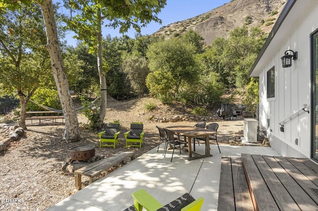 view of patio / terrace featuring a mountain view