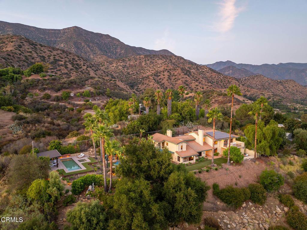 drone / aerial view featuring a mountain view