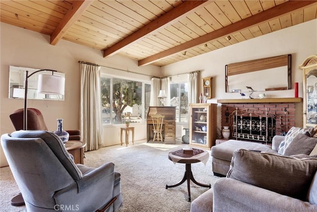 sitting room with plenty of natural light, a brick fireplace, lofted ceiling with beams, and carpet