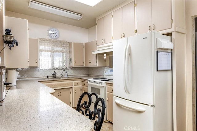 kitchen featuring tasteful backsplash, cream cabinets, sink, and white appliances