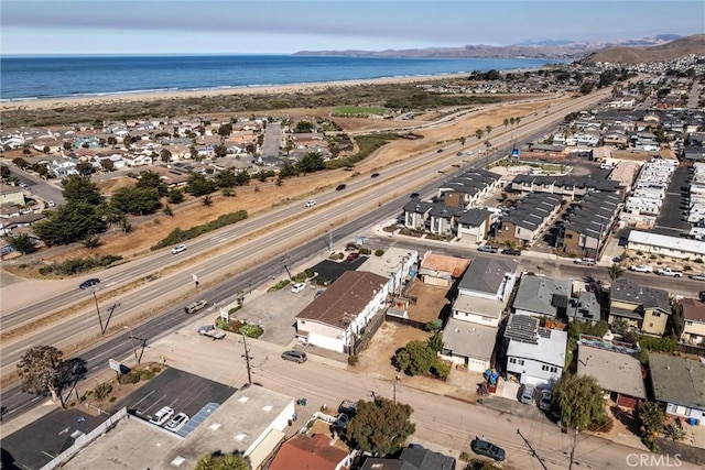 bird's eye view featuring a water view and a view of the beach