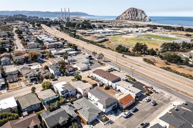 birds eye view of property featuring a water and mountain view