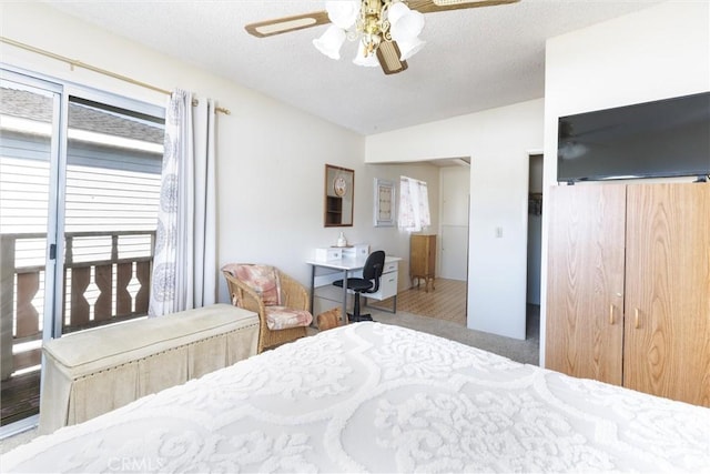 bedroom with ceiling fan, lofted ceiling, and a textured ceiling