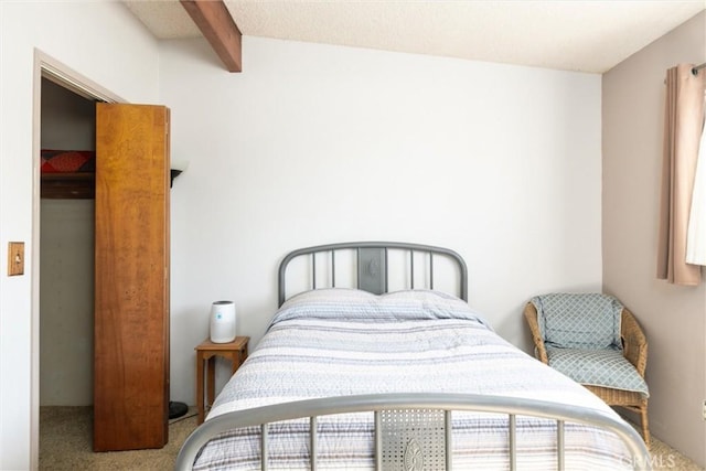 carpeted bedroom featuring lofted ceiling with beams