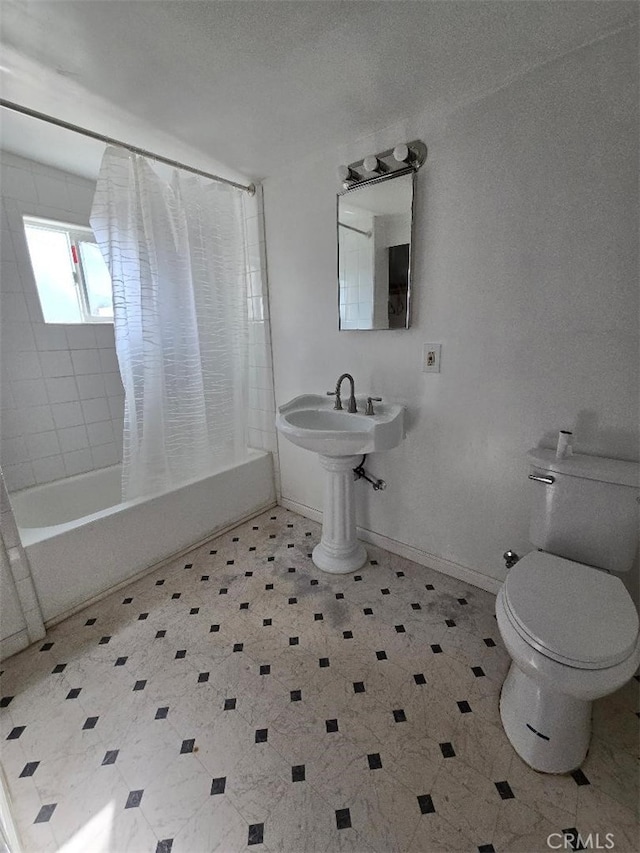 bathroom featuring toilet and shower / tub combo with curtain