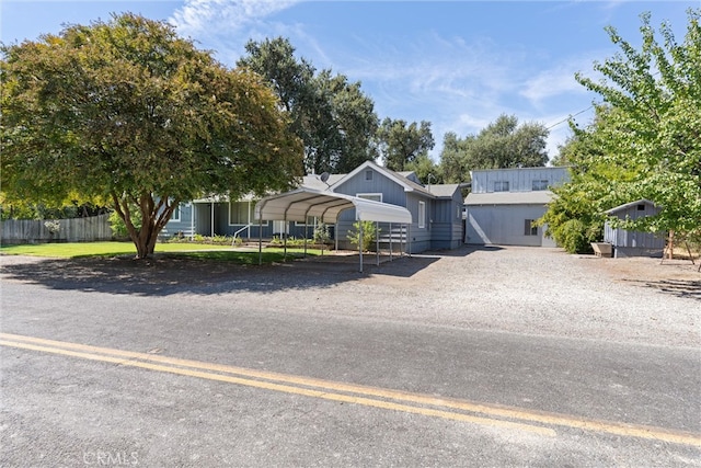 single story home featuring a carport