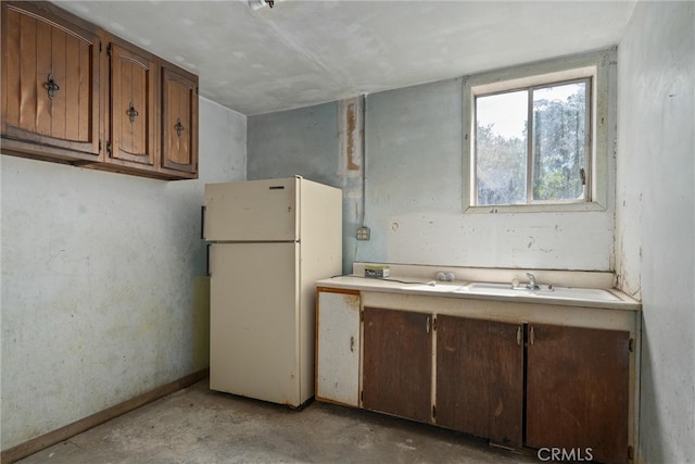 kitchen with white refrigerator and sink