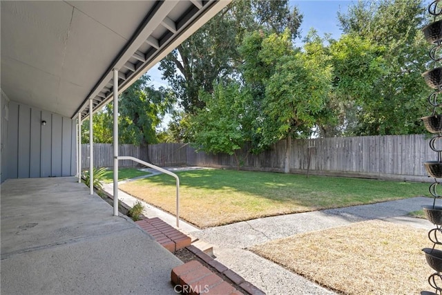view of yard with a fenced backyard and a patio area