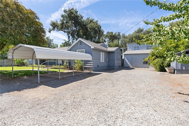 single story home featuring a front yard and a carport