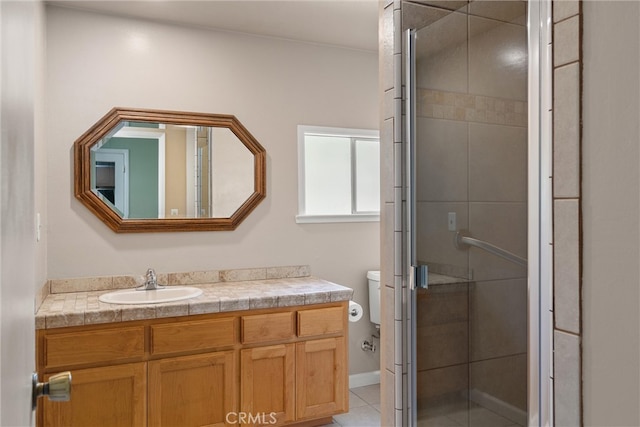 bathroom with tile patterned floors, a shower with shower door, vanity, and toilet