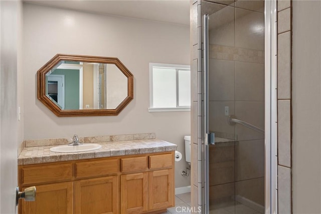 full bath featuring tile patterned floors, vanity, a shower stall, and toilet