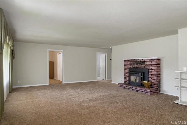 unfurnished living room with carpet flooring and baseboards