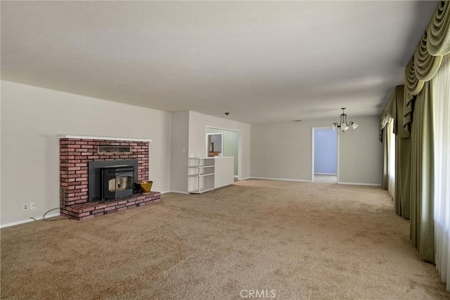 unfurnished living room featuring baseboards, light colored carpet, and an inviting chandelier