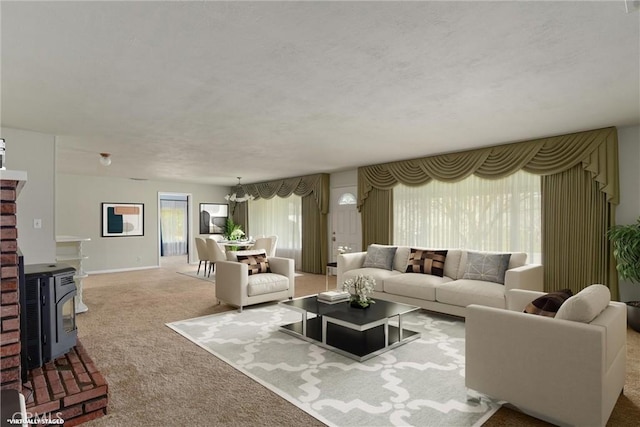 living area featuring a wood stove and carpet