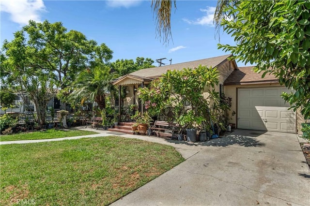 view of front of house featuring a garage and a front lawn