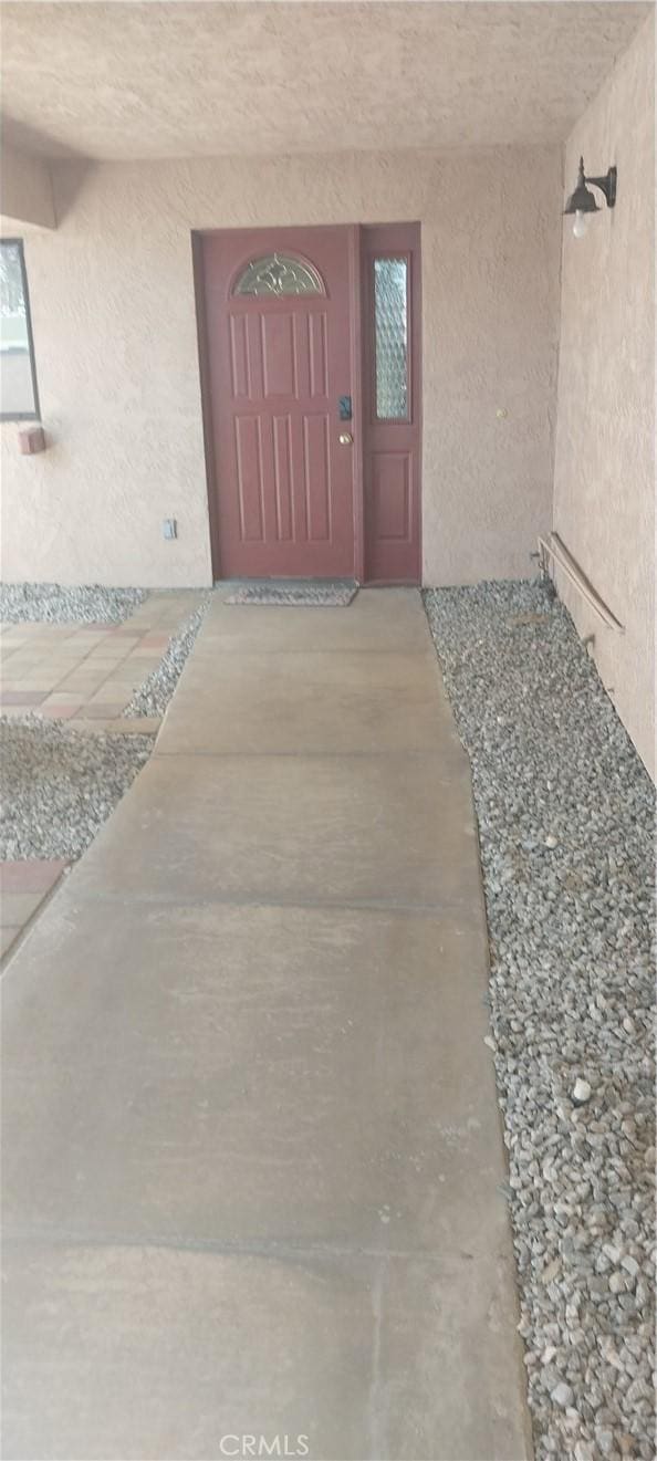 67130 Garbino Rd, Cathedral City, CA 92234 - property entrance featuring stucco siding