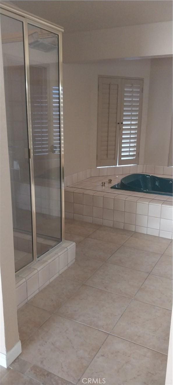 67130 Garbino Rd, Cathedral City, CA 92234 - full bathroom featuring tile patterned flooring, a shower stall, and a bath