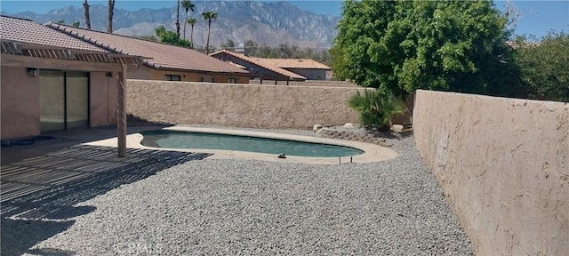 67130 Garbino Rd, Cathedral City, CA 92234 - view of pool with a fenced in pool, a mountain view, fence, and a patio area
