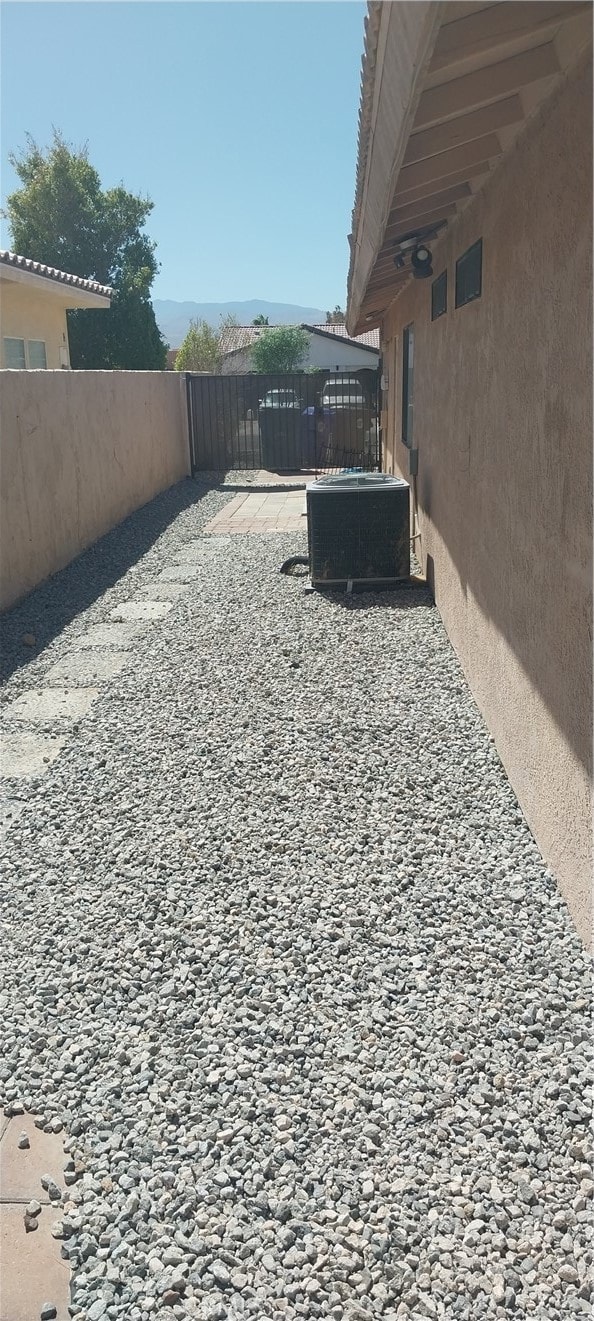 view of yard with a patio and central AC unit