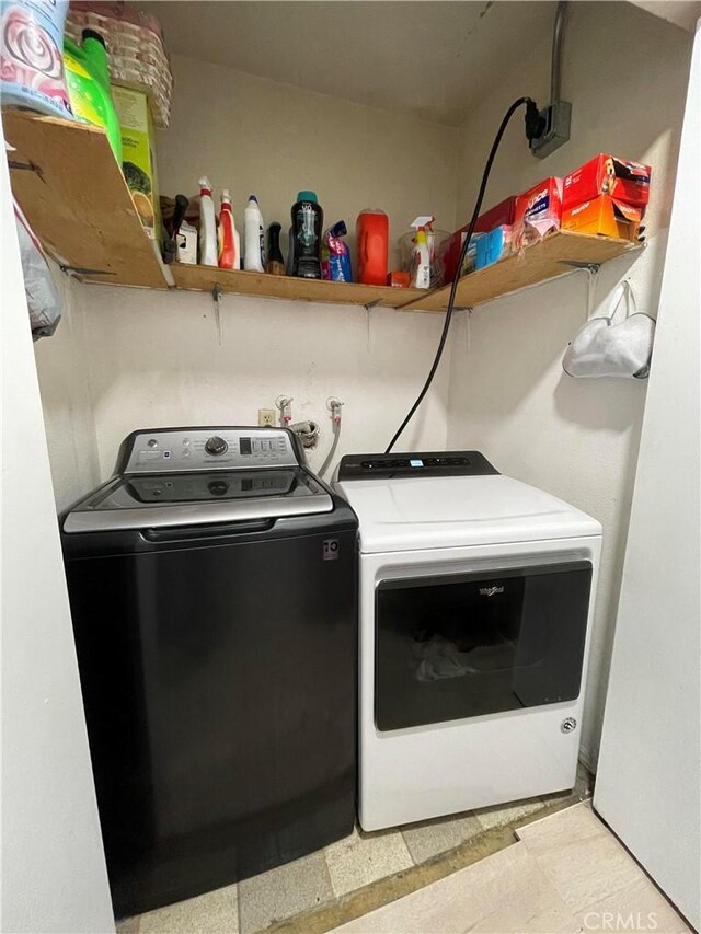 clothes washing area with washer and dryer