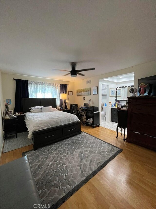 bedroom with ceiling fan and hardwood / wood-style floors