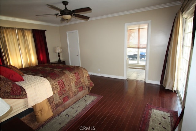 bedroom with ceiling fan, crown molding, and dark hardwood / wood-style flooring