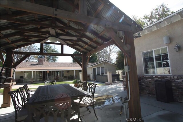 view of patio featuring ceiling fan and a gazebo