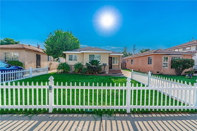 ranch-style home with a front yard