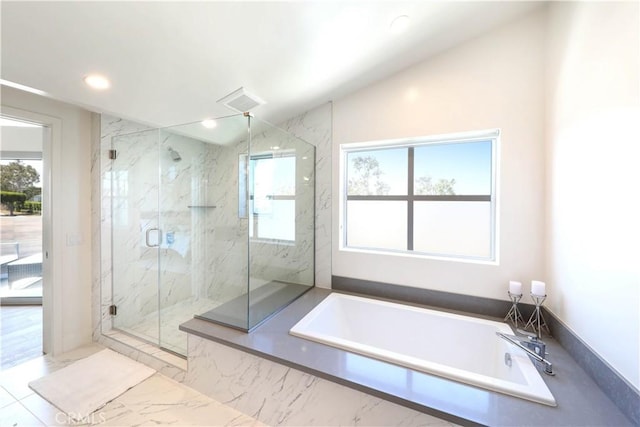 bathroom featuring separate shower and tub and lofted ceiling