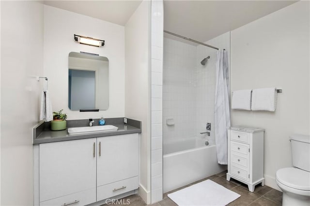 full bathroom with toilet, shower / bath combo, vanity, and tile patterned floors