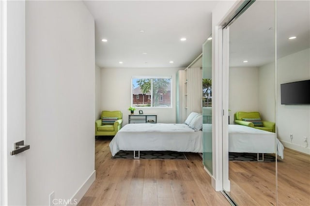 bedroom with light wood-type flooring