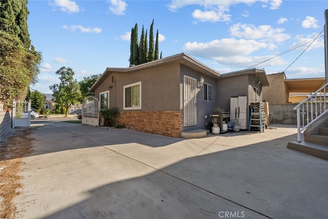 view of home's exterior with a patio area