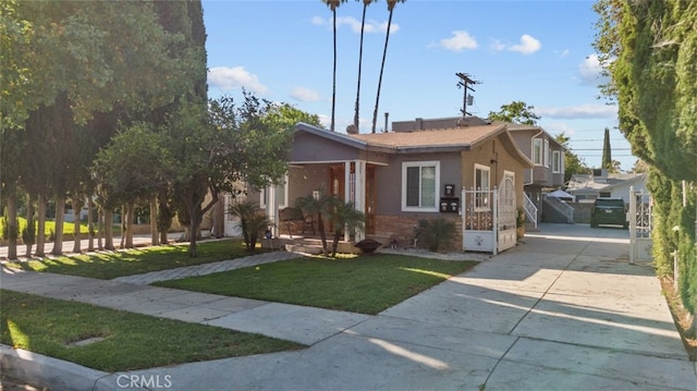 view of front of house featuring a garage and a front lawn